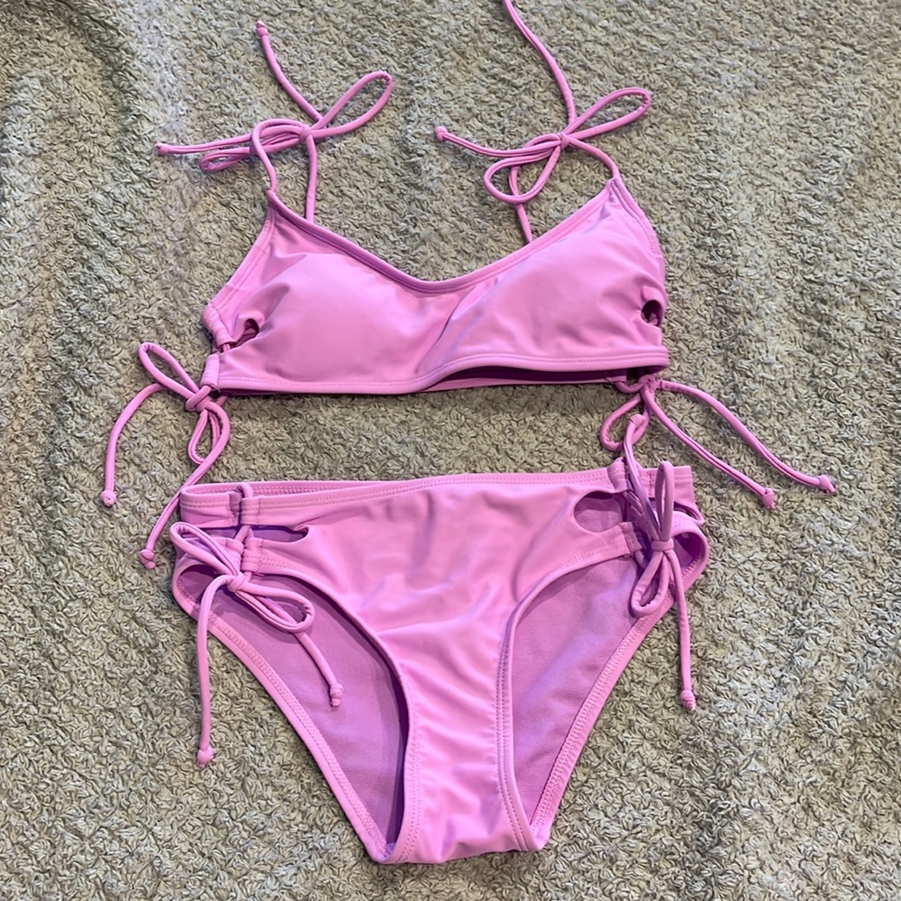 Bikini! XS - color is in between a light pink & hot pink. Super cute!!